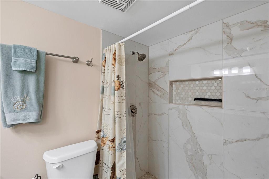 1531 Placida Road, Unit 4102 Englewood, FL 34223 - Photo 28 of 55 a bathroom with a toilet and a shower