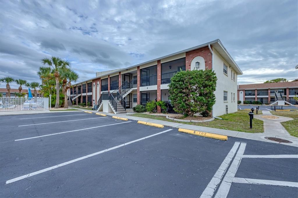 1531 Placida Road, Unit 4102 Englewood, FL 34223 - Photo 5 of 55 a view of a house with a swimming pool and a yard