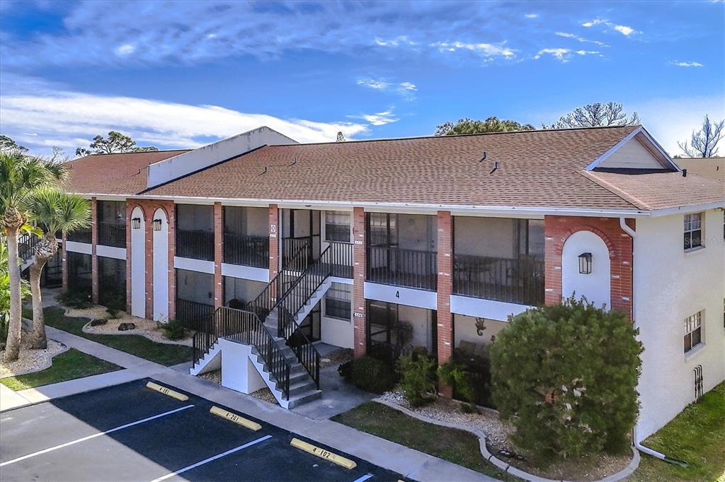 1531 Placida Road, Unit 4102 Englewood, FL 34223 - Photo 54 of 55 a view of a house with sitting area and garden
