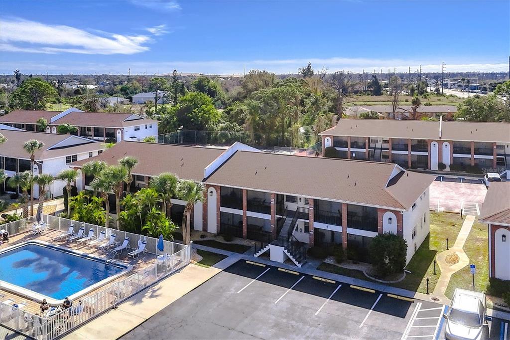 1531 Placida Road, Unit 4102 Englewood, FL 34223 - Photo 55 of 55 an aerial view of a house with swimming pool and outdoor seating