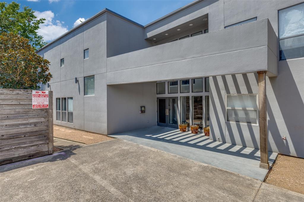 5111 Manett Street, Unit 208 Dallas, TX 75206 - Photo 11 of 13 a view of a house with stairs and wooden fence