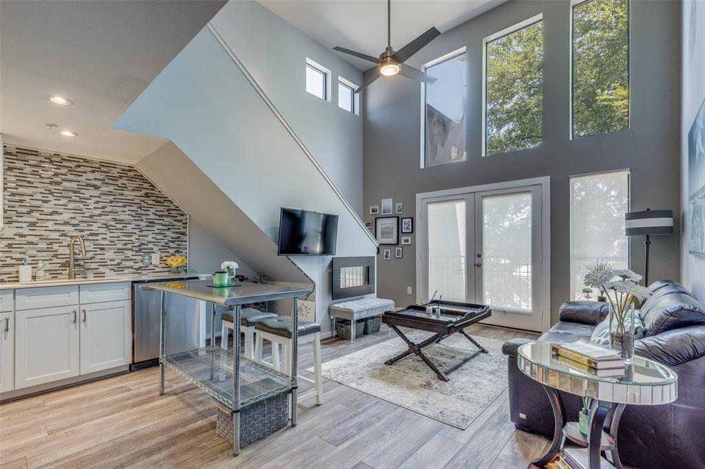 5111 Manett Street, Unit 208 Dallas, TX 75206 - Photo 3 of 13 a living room with furniture a window and appliances