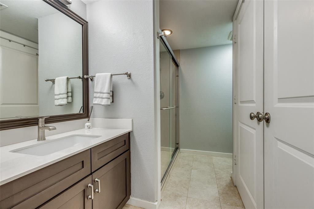 5111 Manett Street, Unit 208 Dallas, TX 75206 - Photo 6 of 13 a bathroom with a sink and a mirror