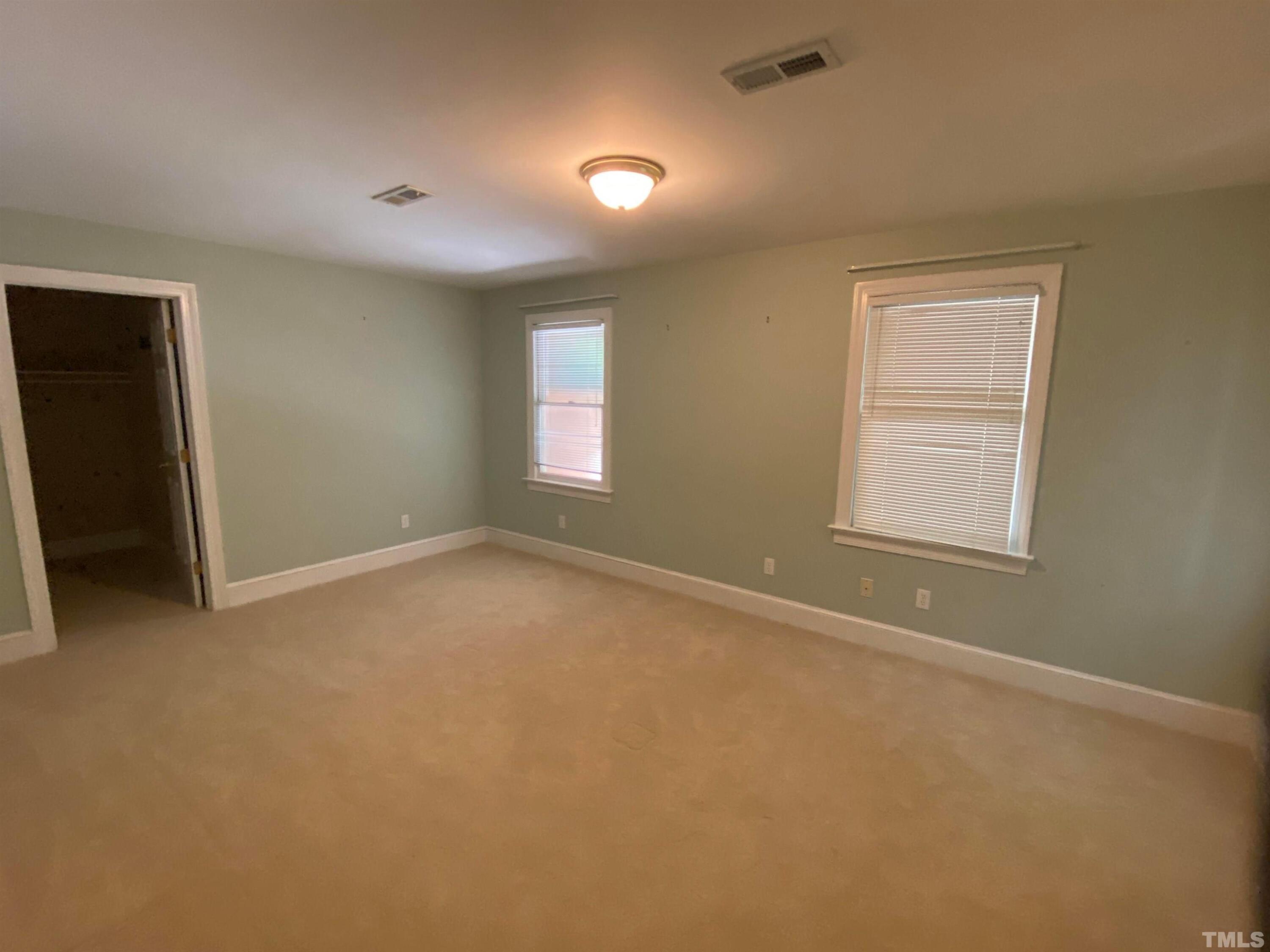 10621 Cahill Road Raleigh, NC 27614 - Photo 15 of 32 a view of an empty room with a window