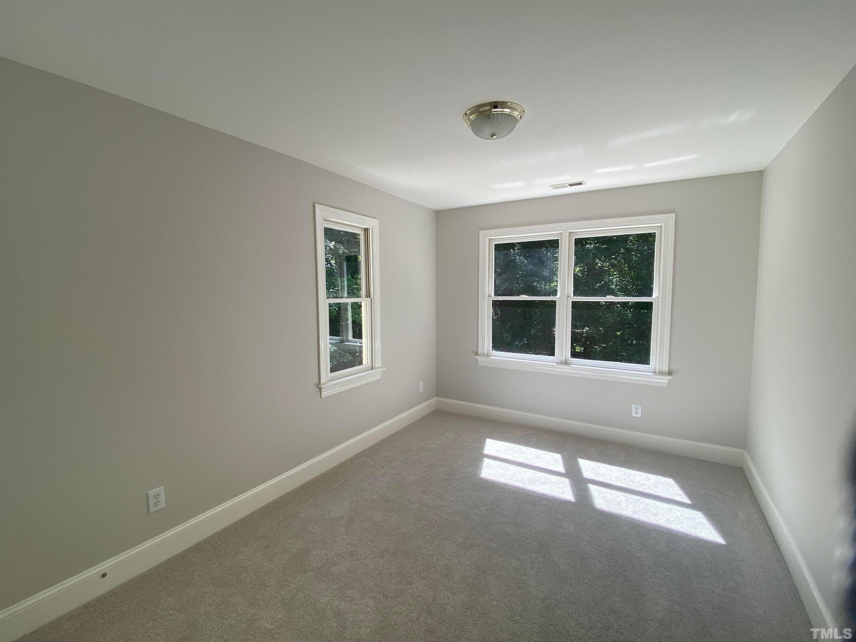 10621 Cahill Road Raleigh, NC 27614 - Photo 20 of 32 an empty room with windows
