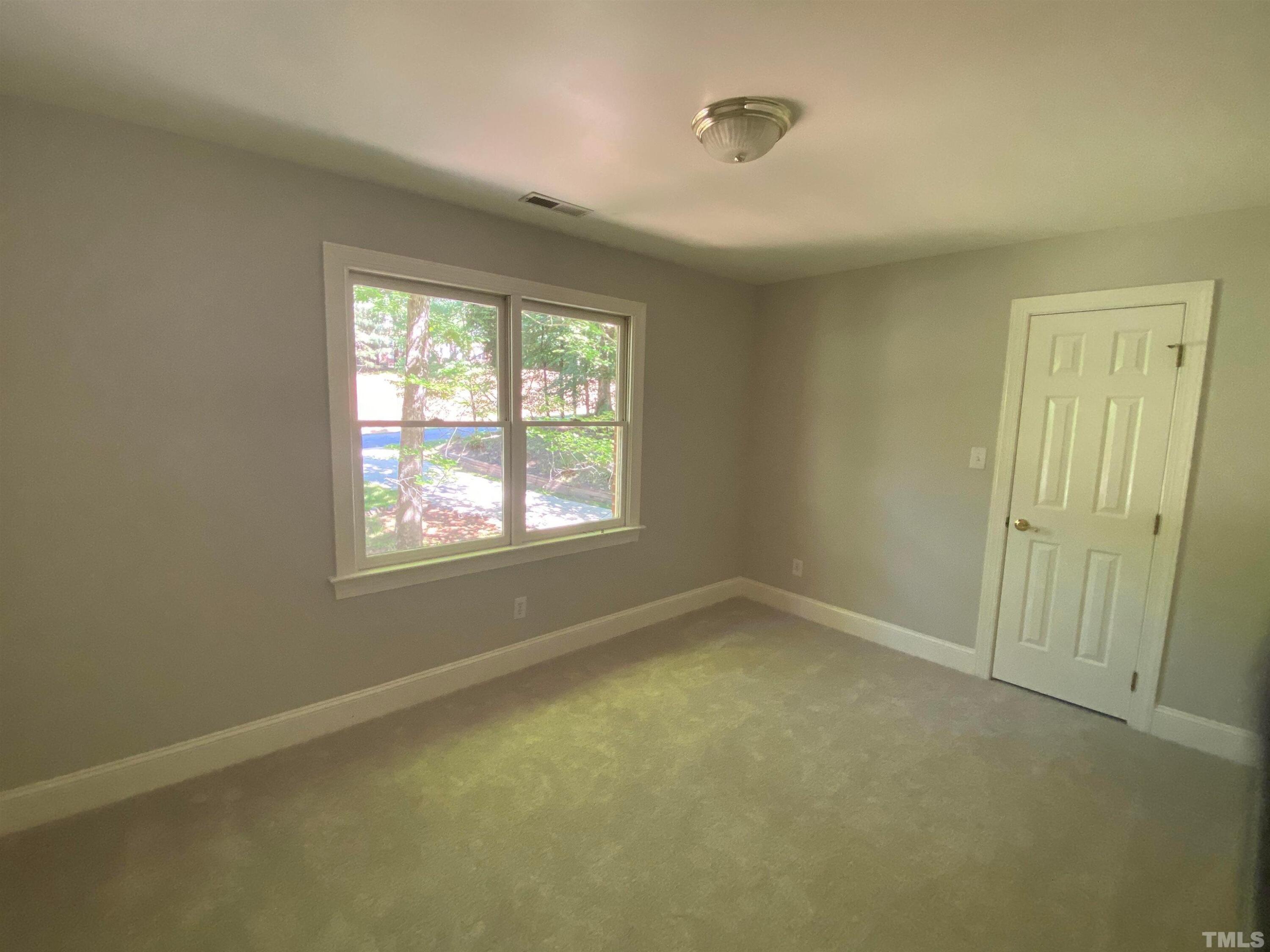 10621 Cahill Road Raleigh, NC 27614 - Photo 21 of 32 an empty room with a window
