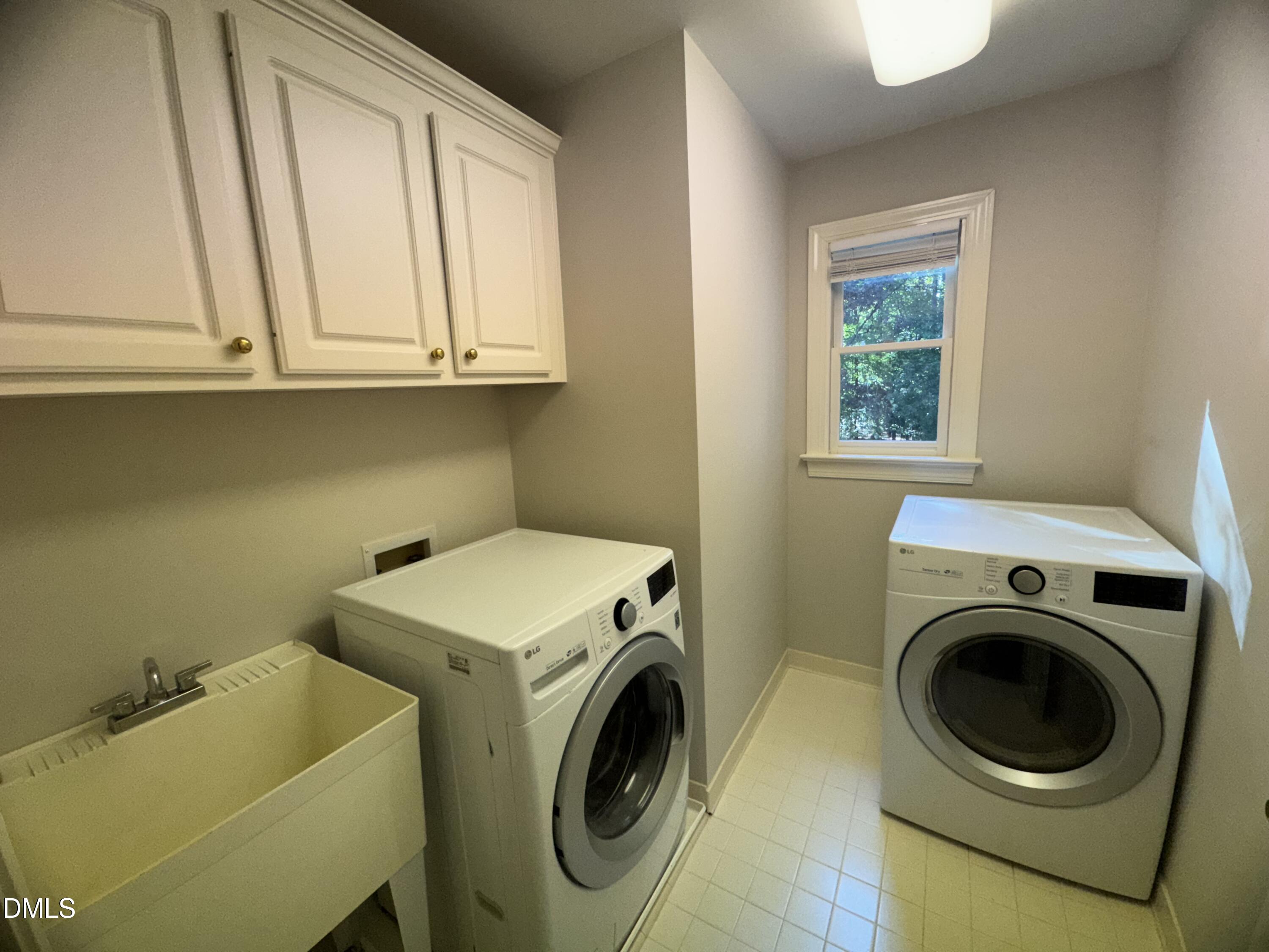 10621 Cahill Road Raleigh, NC 27614 - Photo 26 of 32 a utility room with dryer and washer