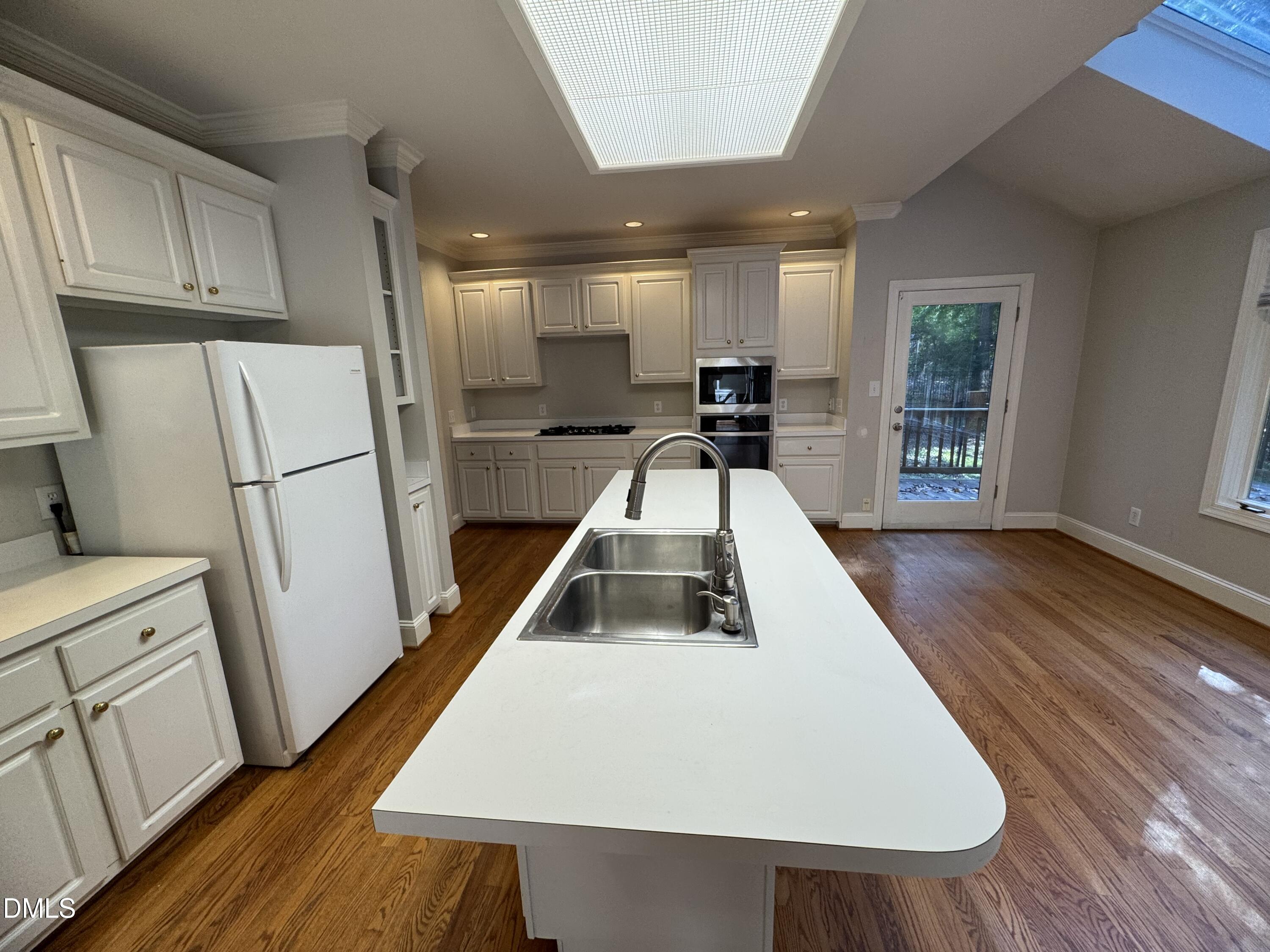 10621 Cahill Road Raleigh, NC 27614 - Photo 3 of 32 a white refrigerator freezer sitting inside of a kitchen
