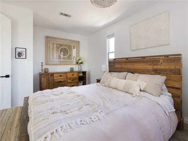 a bedroom with a bed and a cabinets