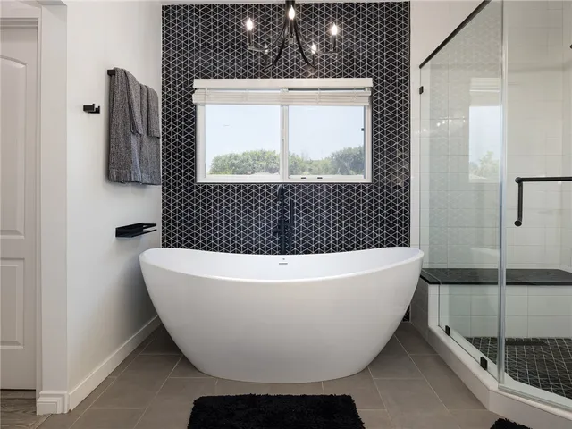 a white bath tub sitting next to a window