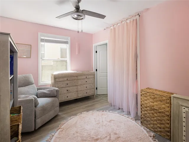 a bedroom with furniture and a chandelier