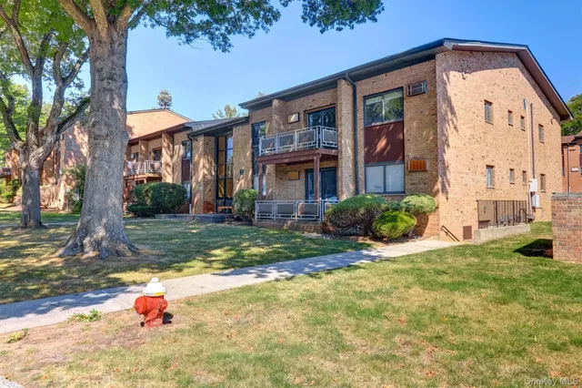 a backyard of a house with yard and outdoor seating