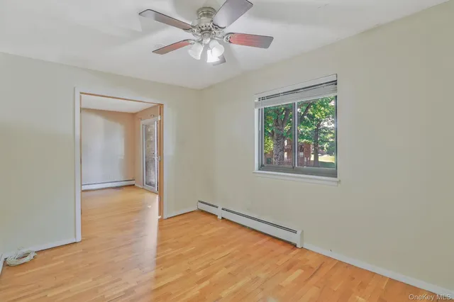 a view of an empty room with a window