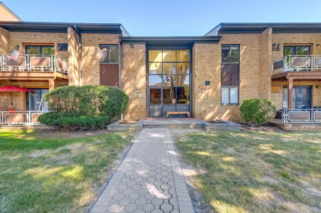 a view of a house with backyard porch and sitting area
