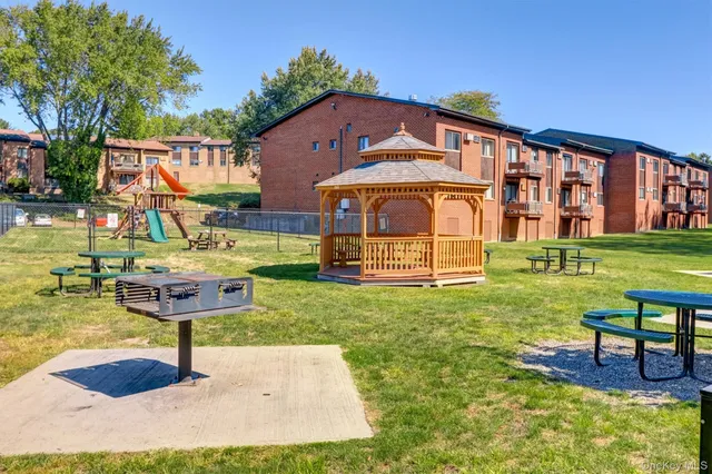 swimming pool view with a seating space