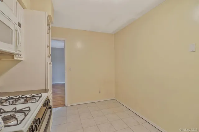 a view of an empty room and utility room