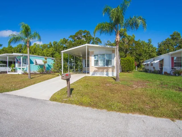 a swimming pool with outdoor seating and yard