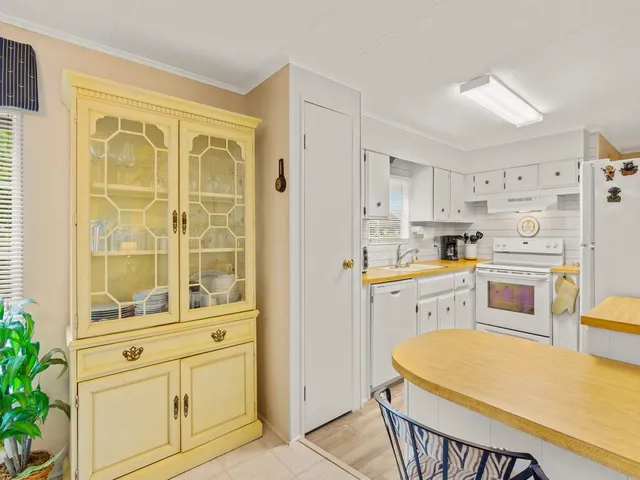 a kitchen with cabinets stainless steel appliances and a counter top space