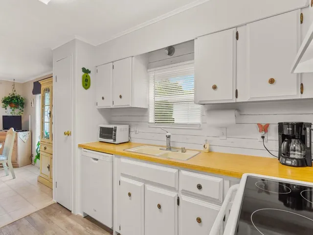 a kitchen with a sink and cabinets