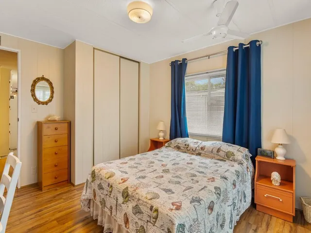 a bedroom with a bed and a closet