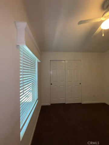 a view of a closet in an empty room