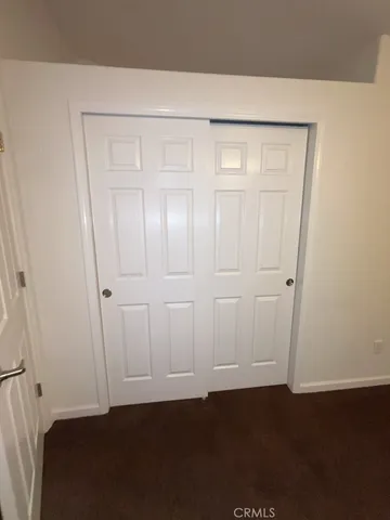 an empty room with wooden floor