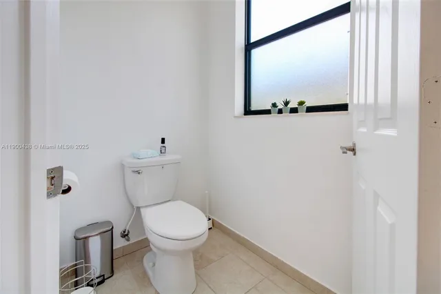 a bedroom with a bed and a night stand