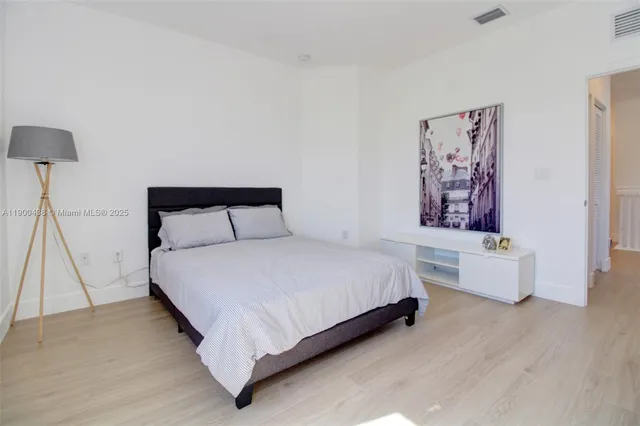 a bedroom with furniture and a window