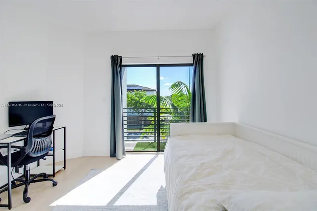 a view of a workspace with furniture