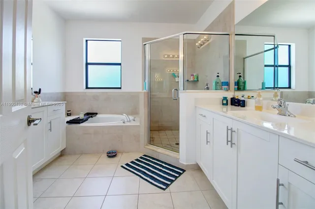 an aerial view of a house with a lake view