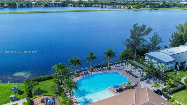 a front view of a house with a yard and a garage