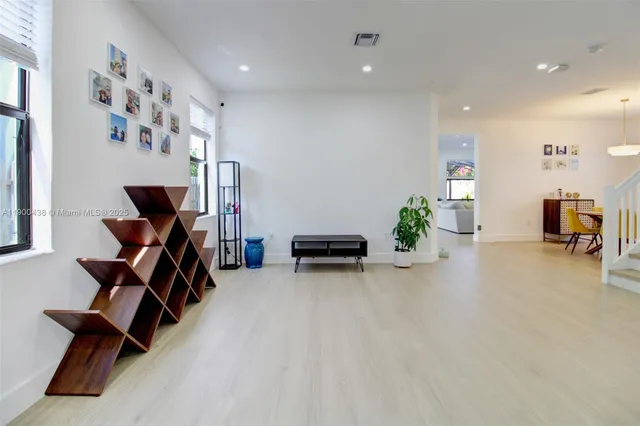 a view of a livingroom with workspace and a couch