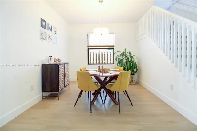 a view of a dining room with furniture and window