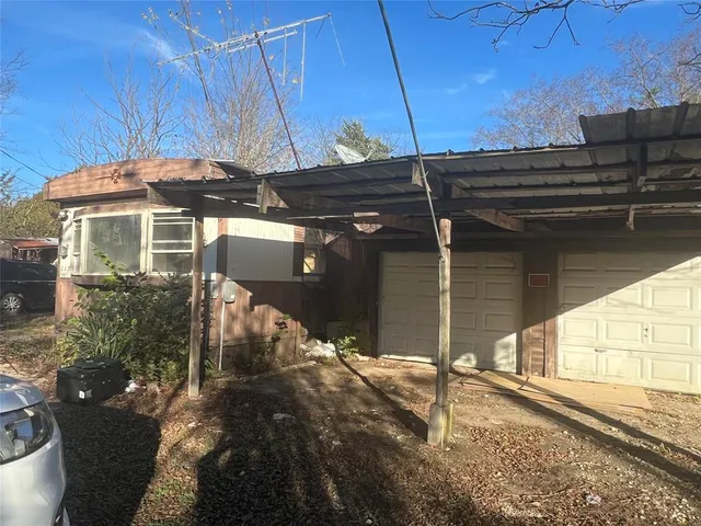 a view of a house with a garage