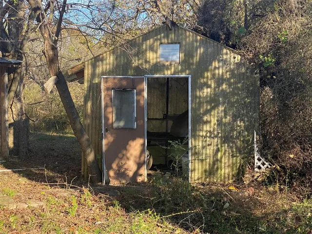 a view of a house with snow on the tree