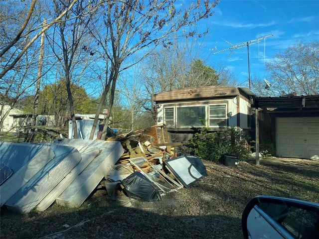 a view of backyard of house with outdoor seating