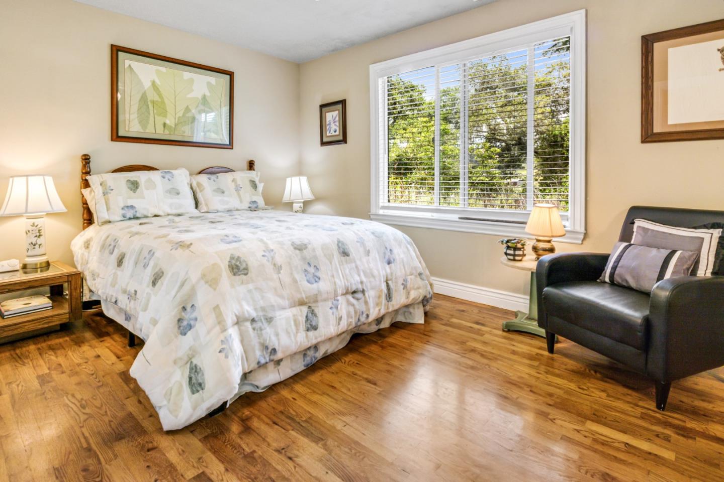 17752 Vierra Canyon Road Salinas, CA 93907 - Photo 16 of 31 a spacious bedroom with a bed and wooden floor