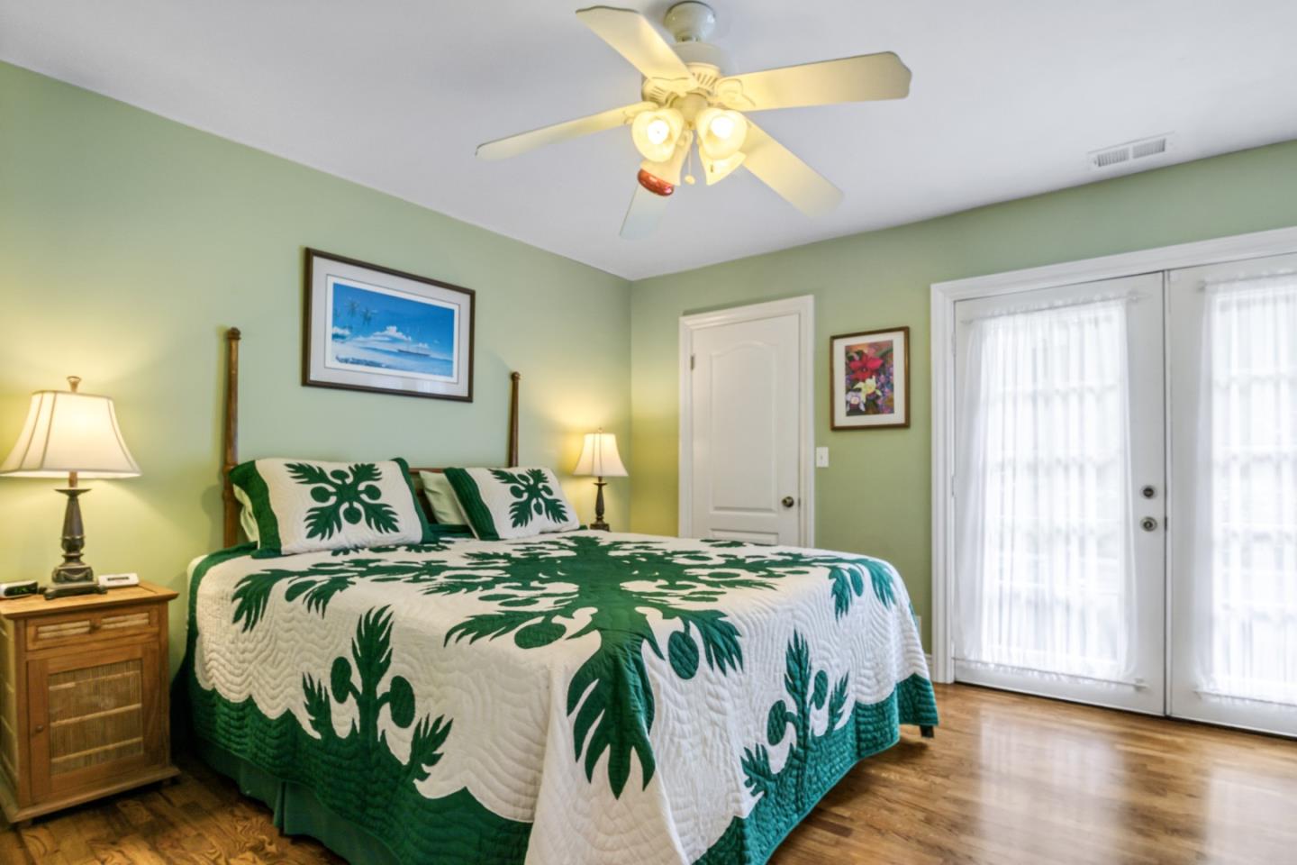 17752 Vierra Canyon Road Salinas, CA 93907 - Photo 22 of 31 a bedroom with a bed and a chandelier