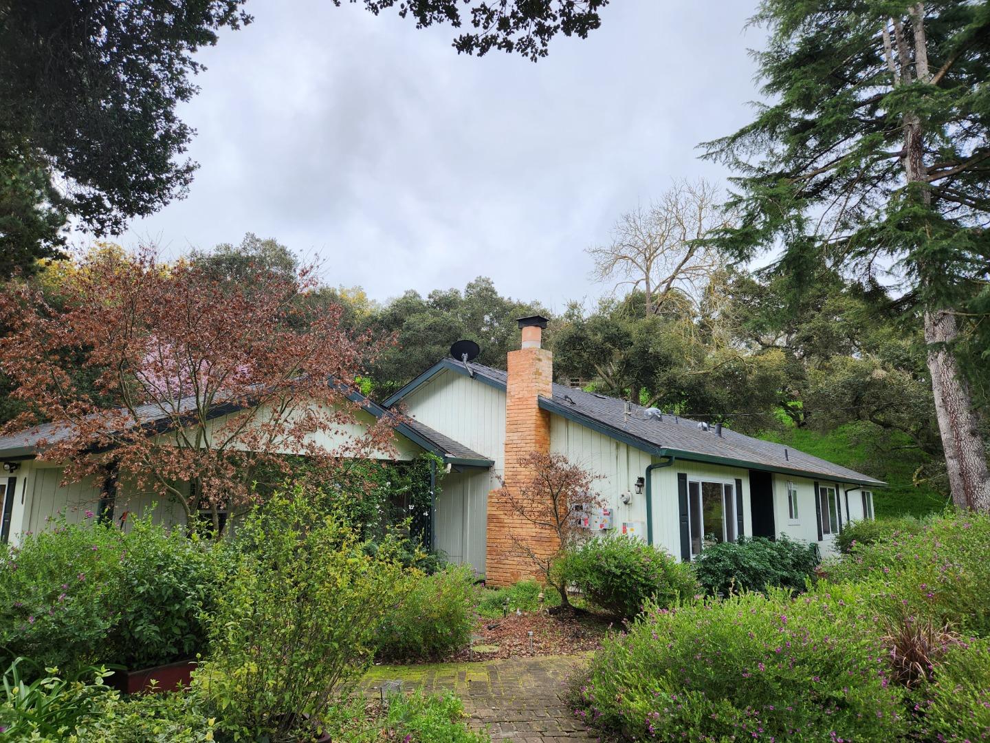 17752 Vierra Canyon Road Salinas, CA 93907 - Photo 26 of 31 a front view of a house with a yard and trees
