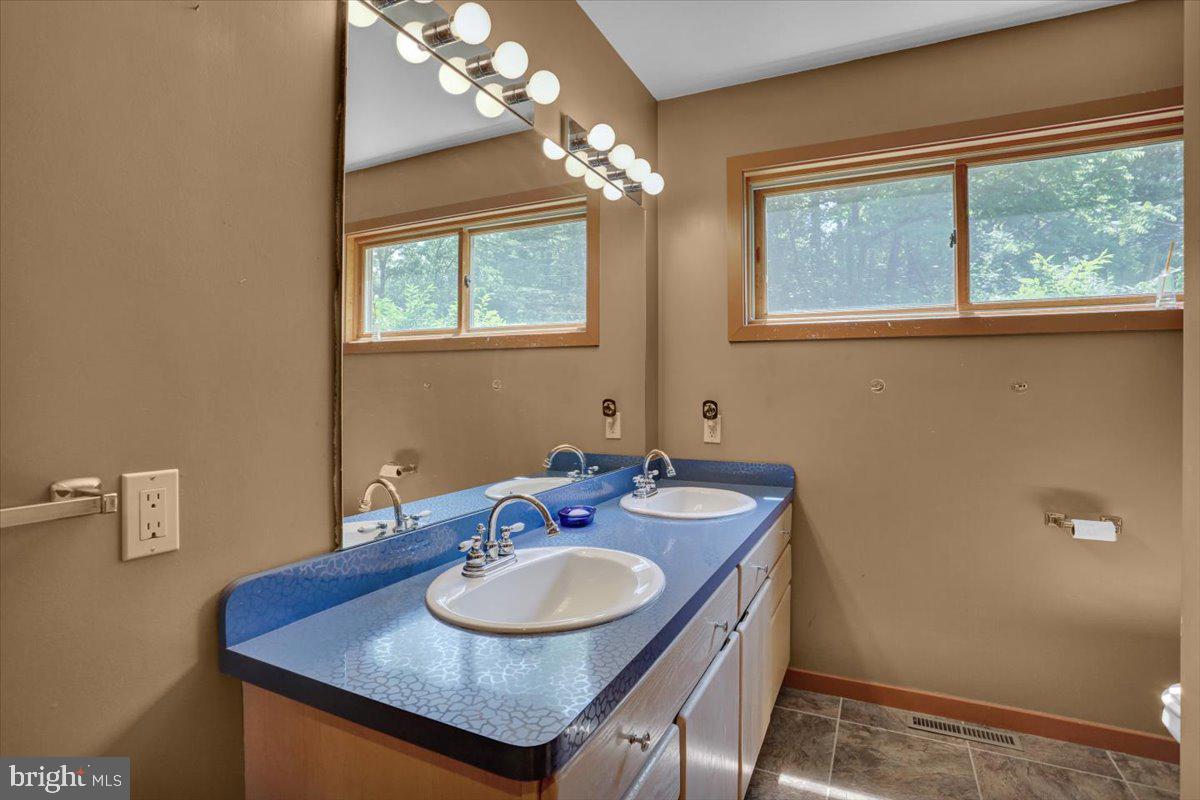 6 Sadowski Drive Reading, PA 19606 - Photo 16 of 66 a bathroom with a sink and a mirror