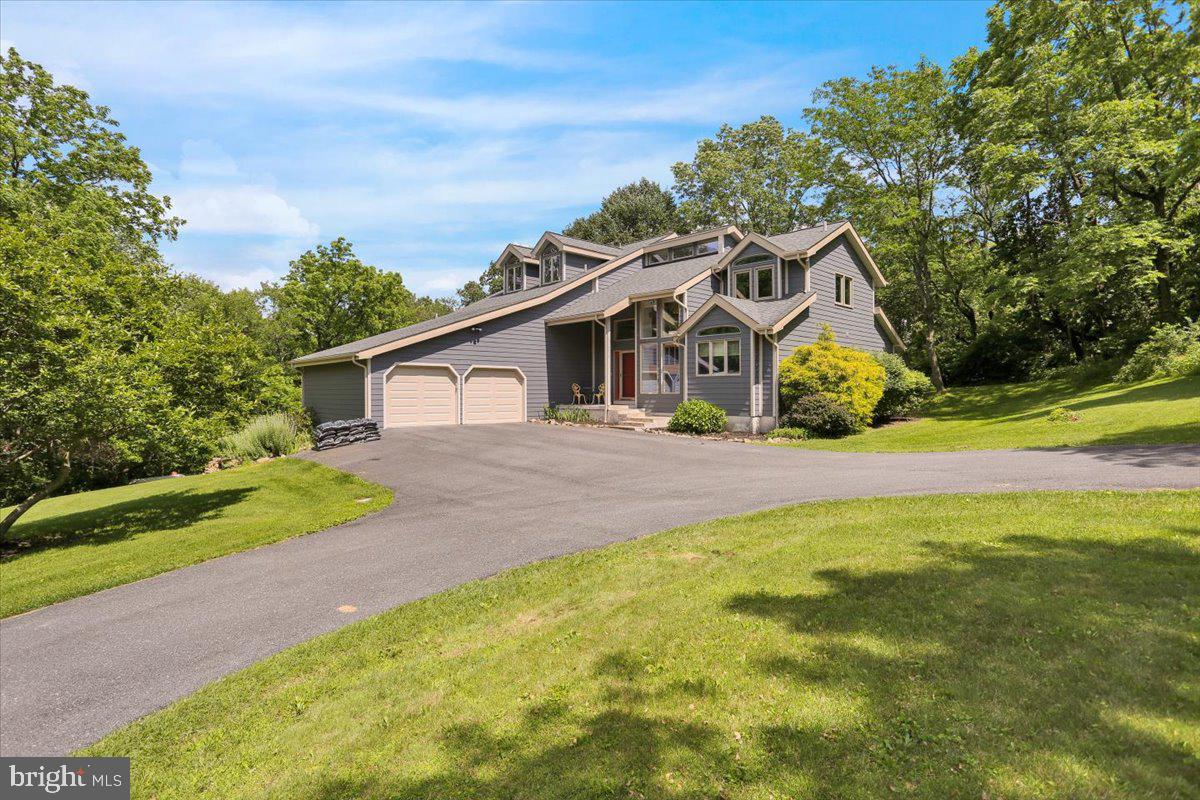6 Sadowski Drive Reading, PA 19606 - Photo 3 of 66 a front view of a house with a garden and yard