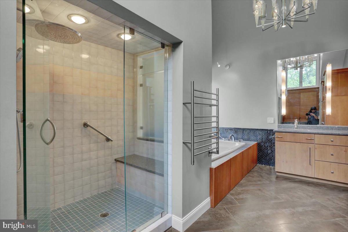 6 Sadowski Drive Reading, PA 19606 - Photo 33 of 66 a bathroom with a granite countertop sink a mirror a glass door a shower and vanity