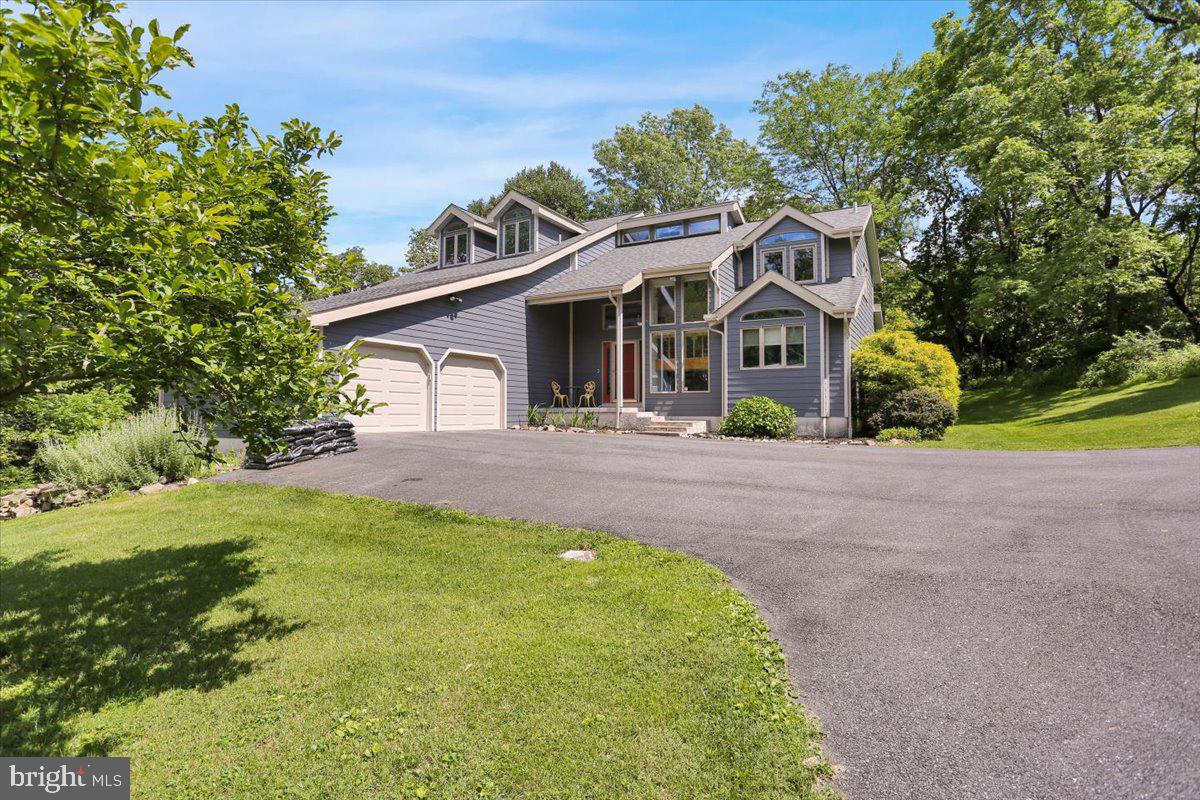 6 Sadowski Drive Reading, PA 19606 - Photo 64 of 66 a front view of a house with a garden and trees