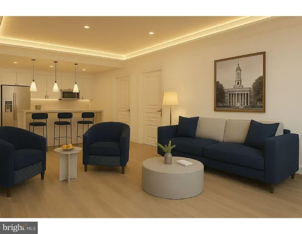 a living room with furniture and a view of kitchen