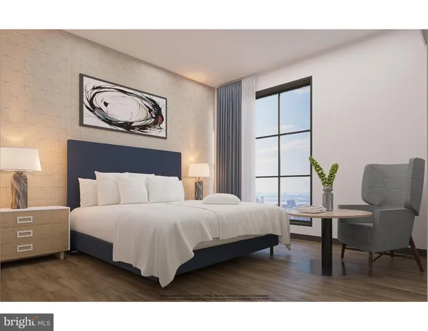 a bedroom with a bed painting on wall and a large window