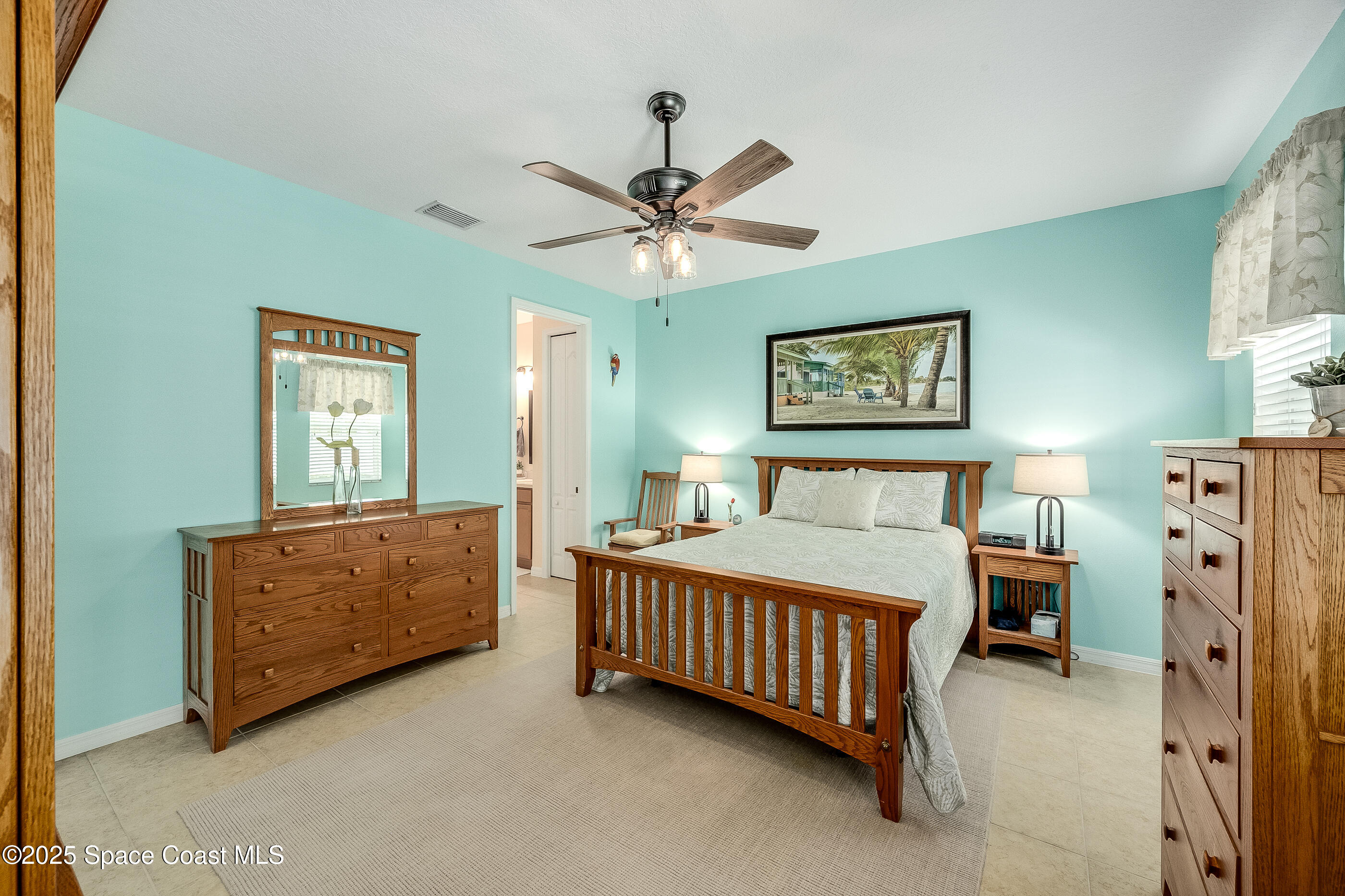 5738 Tamarac Drive Melbourne, FL 32940 - Photo 13 of 27 a bedroom with bed and window
