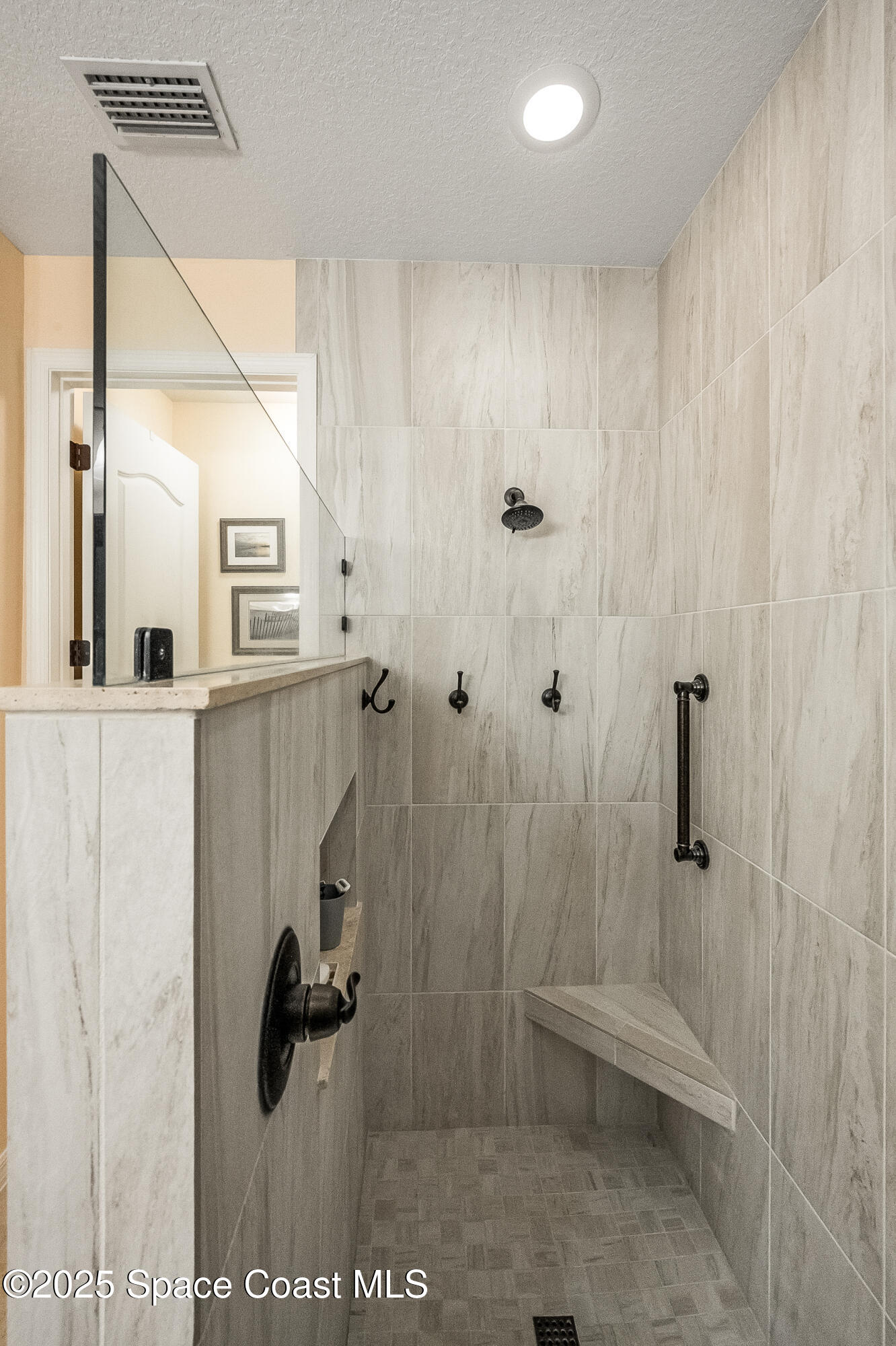 5738 Tamarac Drive Melbourne, FL 32940 - Photo 16 of 27 a bathroom with a shower