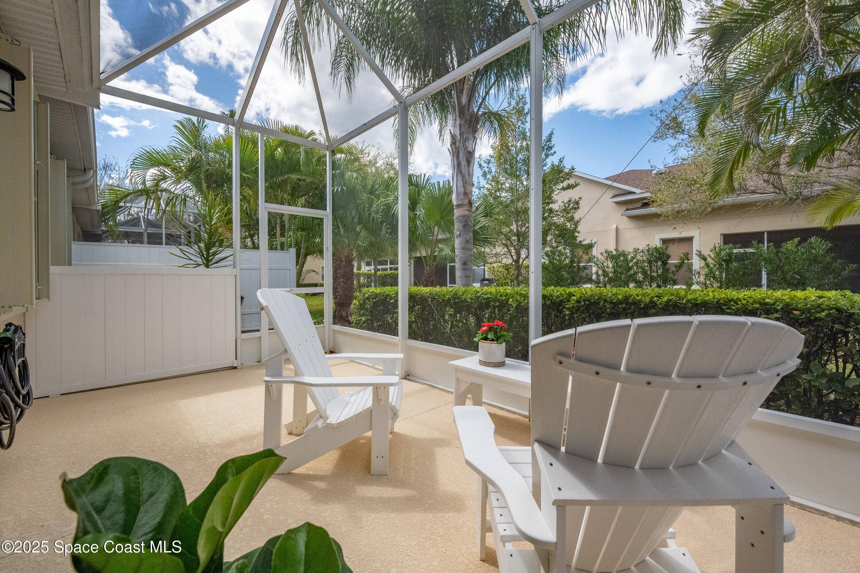5738 Tamarac Drive Melbourne, FL 32940 - Photo 20 of 27 a view of backyard with swimming pool and outdoor seating