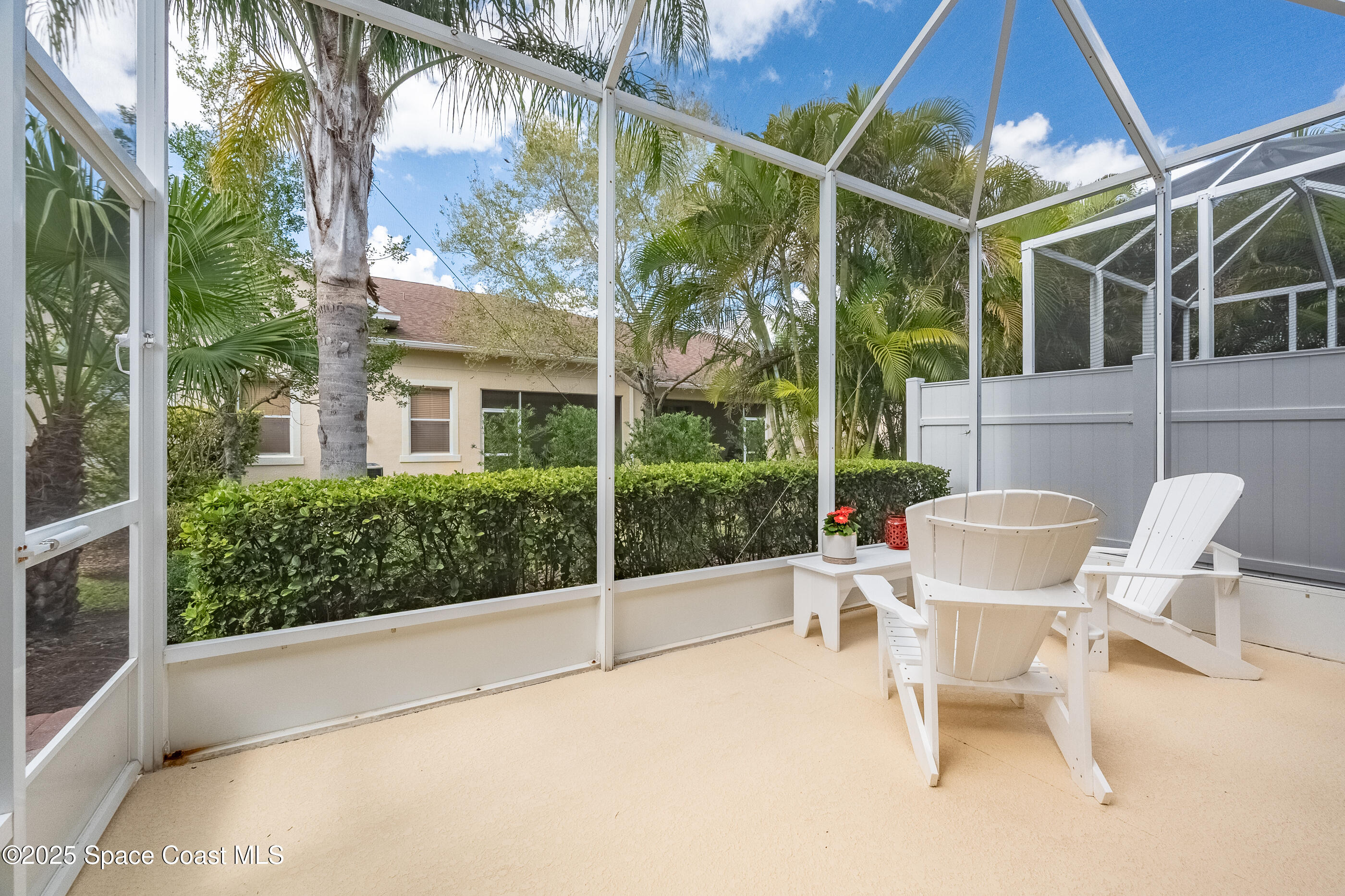 5738 Tamarac Drive Melbourne, FL 32940 - Photo 21 of 27 a view of a chair and tables in the balcony