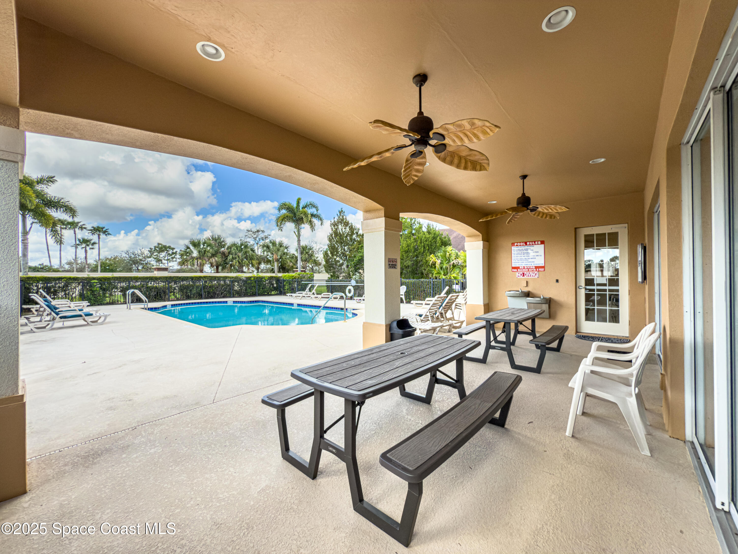 5738 Tamarac Drive Melbourne, FL 32940 - Photo 26 of 27 a living room with furniture and a large window